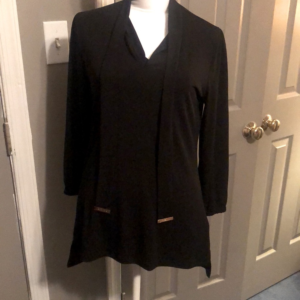 MK blouse with ties. Full sleeve with elastic at the wrist.